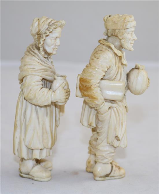 A pair of 19th century Dieppe ivory carvings of an elderly man and woman, 4.25in.